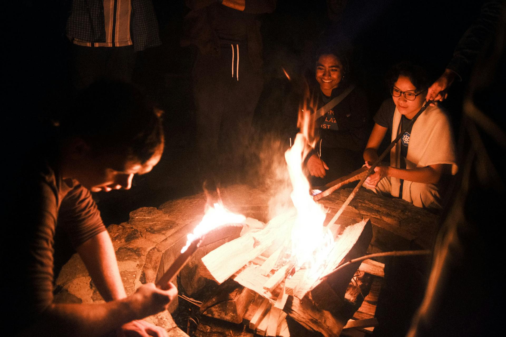 Rabbitholeathon participants sitting around a fire